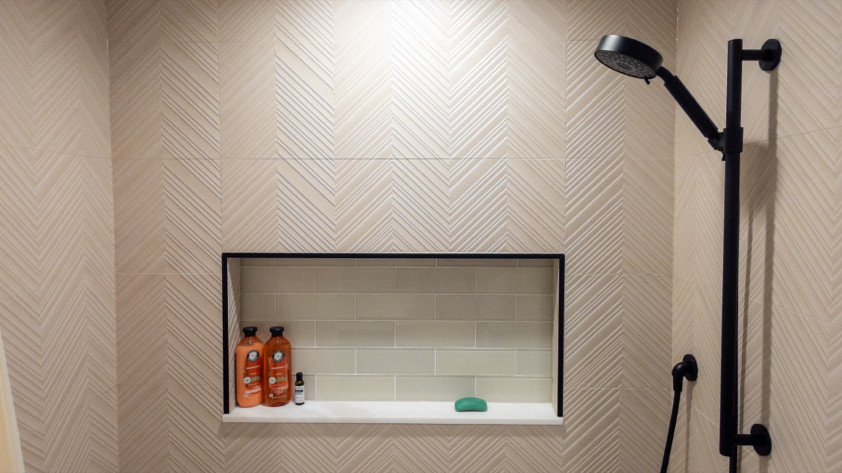 Elegant bathroom featuring artisan fishscale tile accent wall by Quinn Kane Construction, Wisconsin luxury contractor