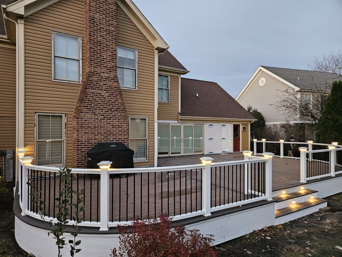 Expansive outdoor living deck with premium composite decking by Quinn Kane Construction, Lake Geneva