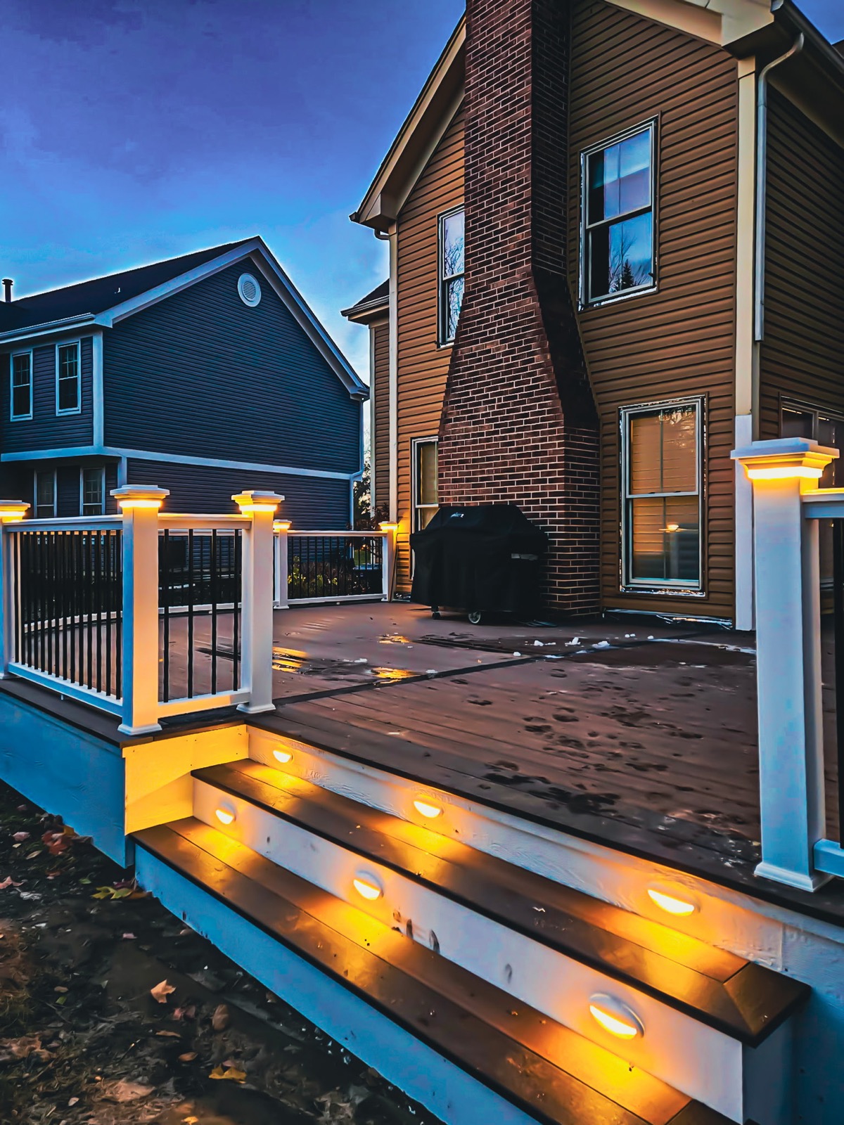 Stunning illuminated deck with ambient lighting for evening entertaining by QKC, Illinois outdoor living specialist