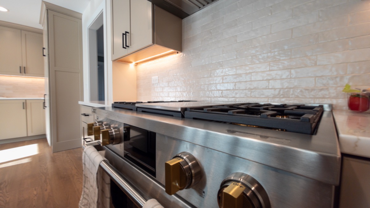 Gourmet kitchen with designer tile backsplash by Quinn Kane Construction, Wisconsin luxury remodeling
