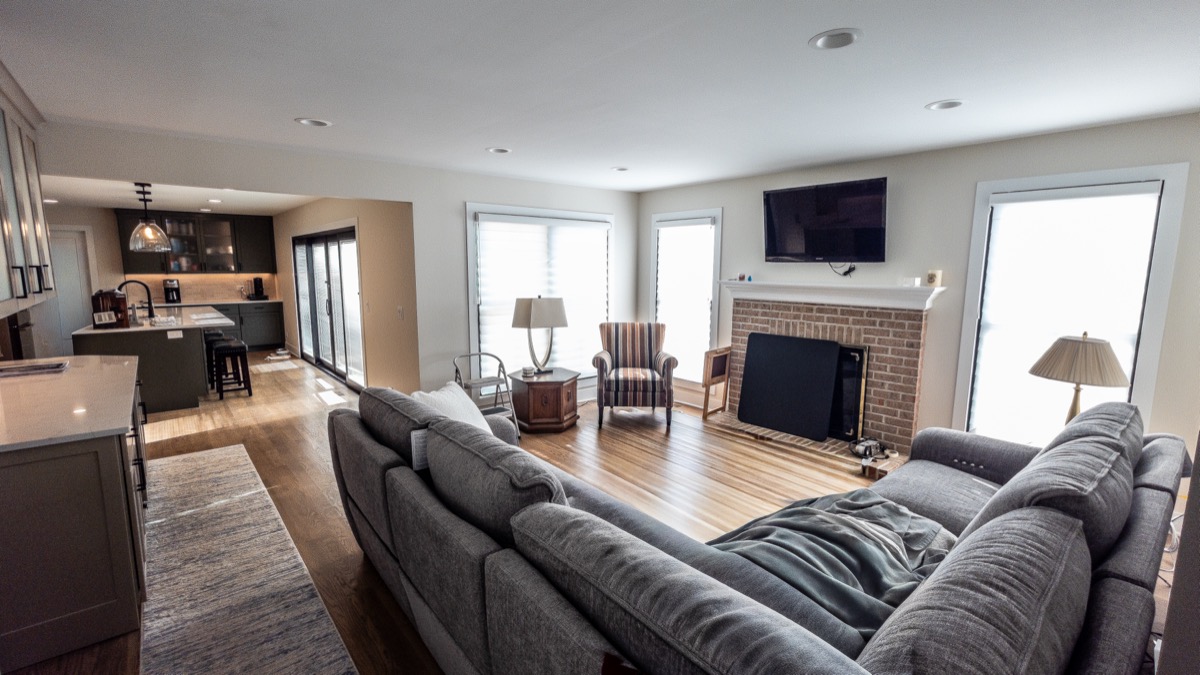 Elegant living room with custom-built fireplace surround by Quinn Kane Construction, Lake Geneva remodeling