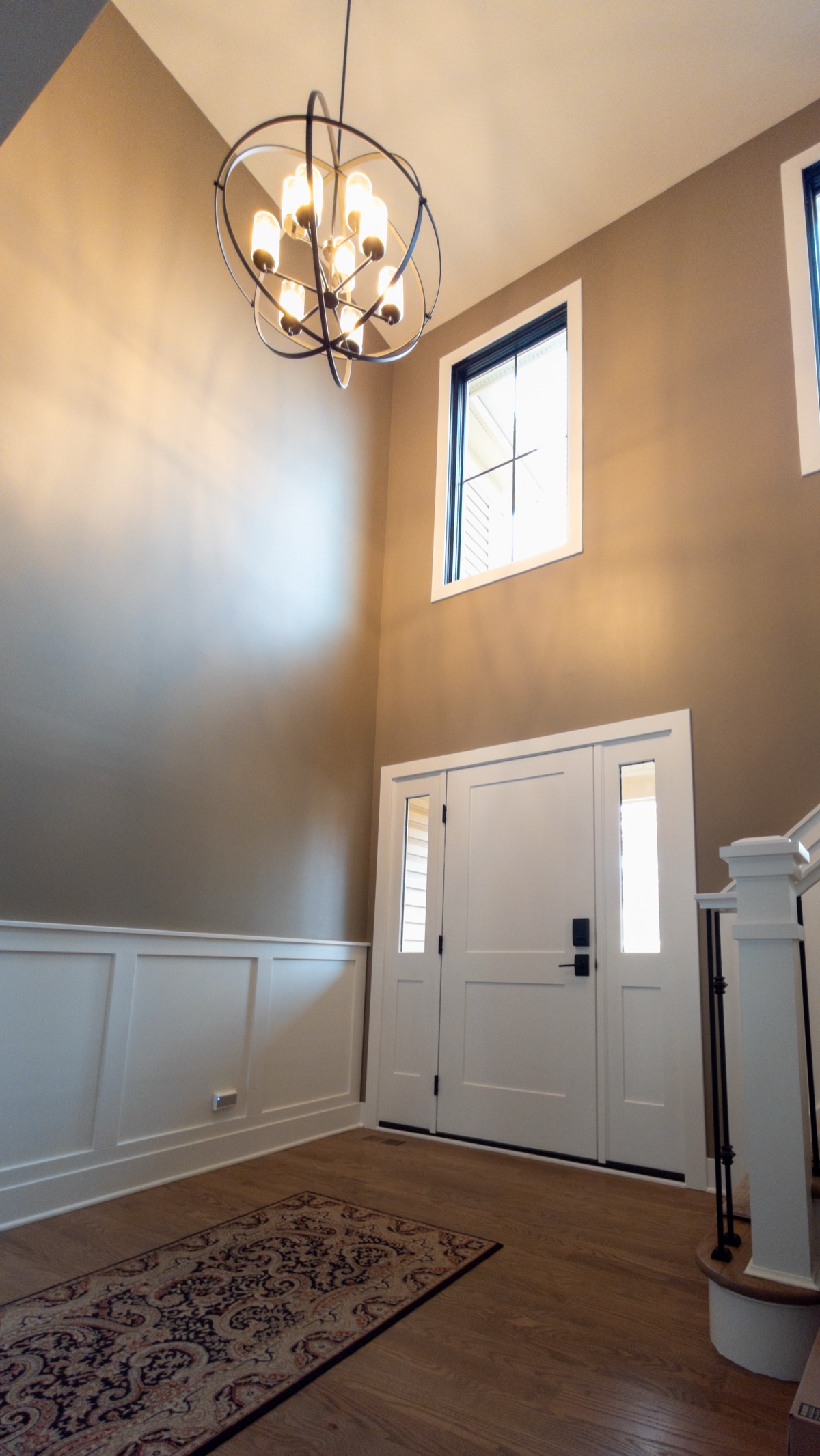 Grand entryway with architectural door design by QKC, Illinois luxury home contractor